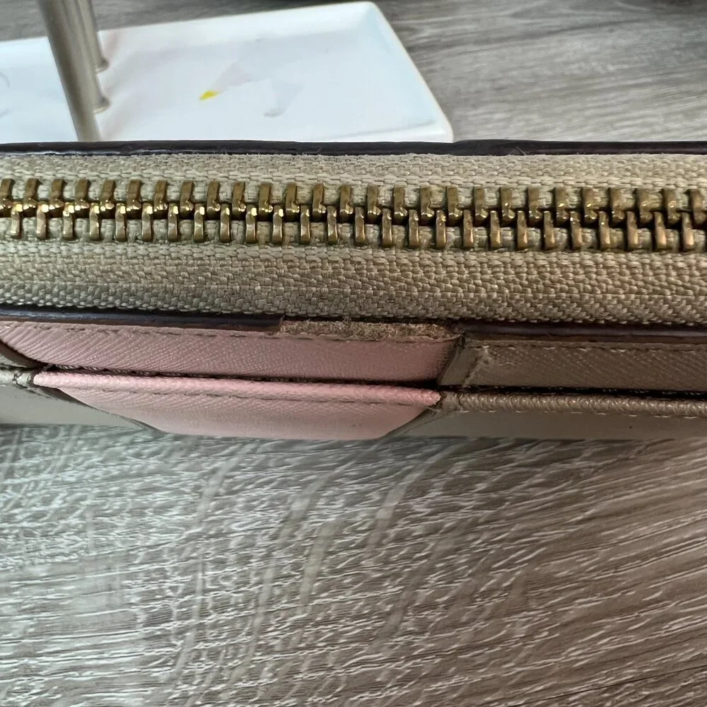 Kate sapde Accordion zip around wallet clutch